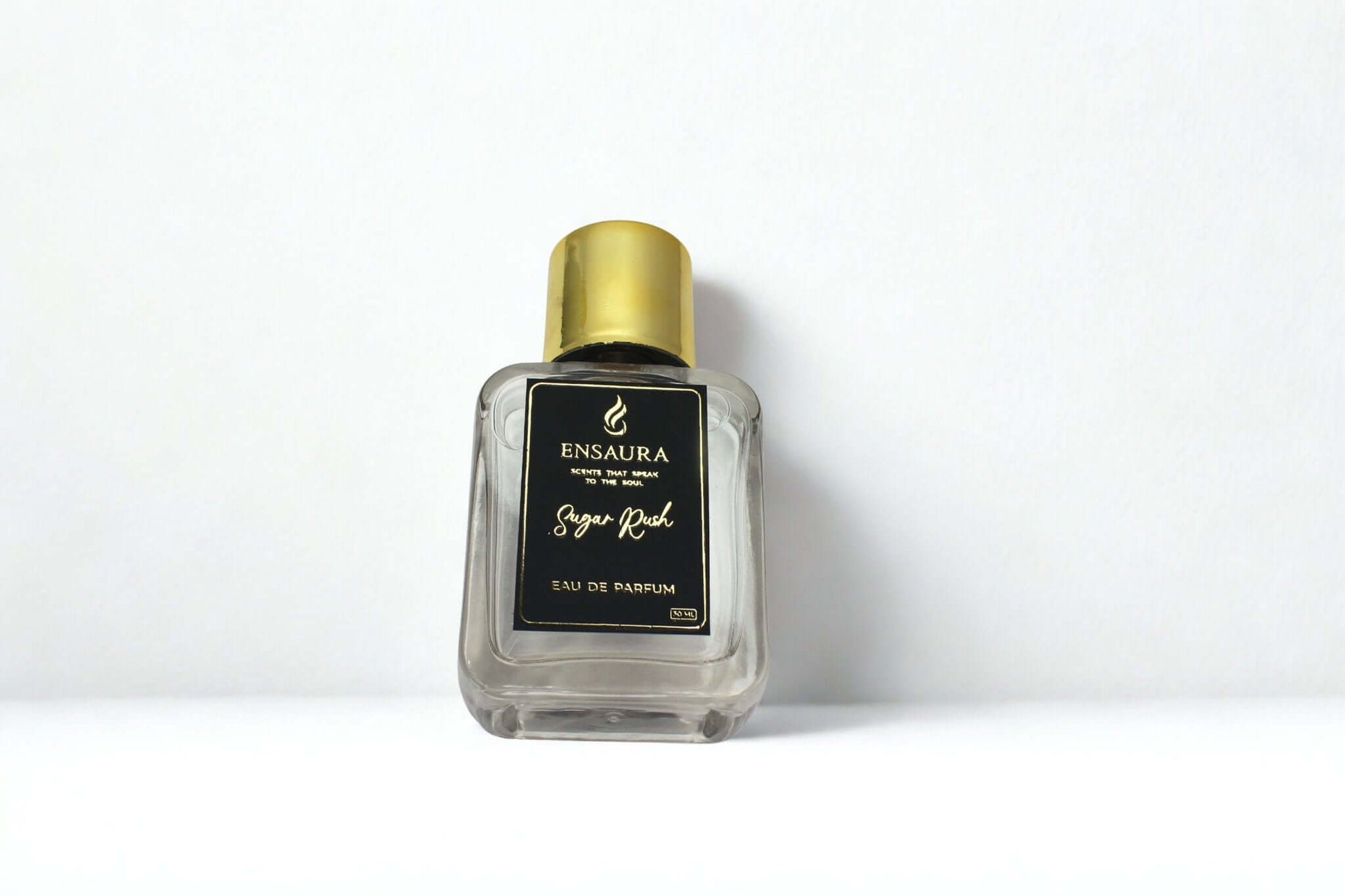 Sugar Rush women perfume 50ml in a clear bottle with gold cap, displaying sweet and irresistible fragrance.